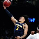 Michigan's Jaelin Llewellyn (3) drives past Arizona State's Marcus Bagley (23) during the first half of an NCAA college basketball game in the championship round of the Legends Classic Thursday, Nov. 17, 2022, in New York. (AP Photo/Frank Franklin II)