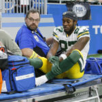 Green Bay Packers wide receiver Romeo Doubs is helped off the field during the first half of an NFL football game against the Detroit Lions, Sunday, Nov. 6, 2022, in Detroit. (AP Photo/Duane Burleson)