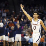 
              Virginia's Kihei Clark (0) celebrates after a basket against Monmouth during the first half of an NCAA college basketball game in Charlottesville, Va., Friday, Nov. 11, 2022. (AP Photo/Mike Kropf)
            