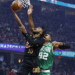 
              Cleveland Cavaliers guard Darius Garland (10) shoots against Boston Celtics center Al Horford (42) during the first half of an NBA basketball game Wednesday, Nov. 2, 2022, in Cleveland. (AP Photo/Ron Schwane)
            