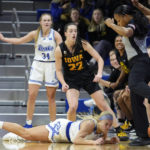
              Drake guard Katie Dinnebier fights for a loose ball with Iowa guard Caitlin Clark (22) during the first half of an NCAA college basketball game, Sunday, Nov. 13, 2022, in Des Moines, Iowa. (AP Photo/Charlie Neibergall)
            