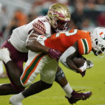 
              Florida State defensive lineman Jared Verse (5) tackles Miami wide receiver Brashard Smith (12) during the first half of an NCAA college football game, Saturday, Nov. 5, 2022, in Miami Gardens, Fla.(AP Photo/Lynne Sladky)
            