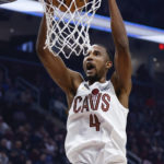 
              Cleveland Cavaliers forward Evan Mobley dunks against the Miami Heat during the first half of an NBA basketball game, Sunday, Nov. 20, 2022, in Cleveland. (AP Photo/Ron Schwane)
            