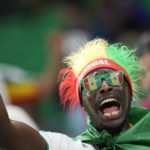 A fan of Senegal team cheers before the start of the World Cup group A soccer match between Senegal and Netherlands at the Al Thumama Stadium, in Doha, Qatar, Monday, Nov. 21, 2022. (AP Photo/Ebrahim Noroozi)