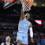 
              North Carolina guard Caleb Love dunks the ball against Portland during the first half of an NCAA college basketball game in the Phil Knight Invitational tournament in Portland, Ore., Thursday, Nov. 24, 2022. (AP Photo/Craig Mitchelldyer)
            