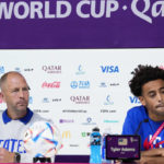 head coach Gregg Berhalter of the United States and Tyler Adams attend a press conference on the eve of the group B World Cup soccer match between Iran and the United States in Doha, Qatar, Monday, Nov. 28, 2022. (AP Photo/Ashley Landis)