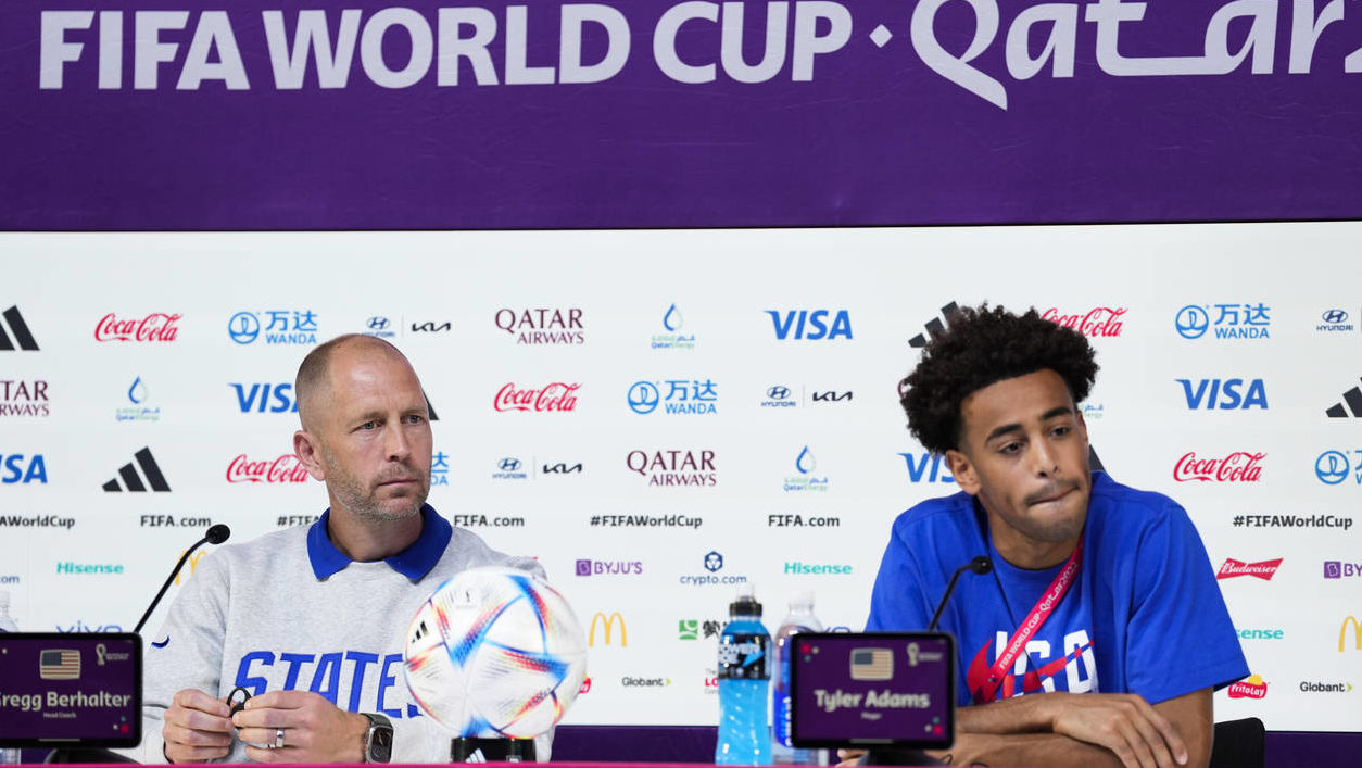 head coach Gregg Berhalter of the United States and Tyler Adams attend a press conference on the ev...