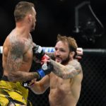 New Zealand's Brad Riddell, right, punches Brazil's Renato Moicano during a lightweight bout at the UFC 281 mixed martial arts event, Saturday, Nov. 12, 2022, in New York. Moicano stopped Riddell in the first round. (AP Photo/Frank Franklin II)