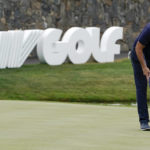 
              FILE - Phil Mickelson lines up a shot on the 18th hole during the first round of the Bedminster Invitational LIV Golf tournament in Bedminster, N.J., Friday, July 29, 2022.  Like the Saudi-backed LIV Golf league, critics describe the 2022 World Cup, which starts Sunday, as a classic case of “sportswashing” — using sports to change a country or company's image. (AP Photo/Seth Wenig)
            