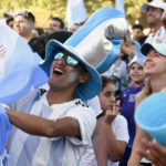 
              Argentine soccer fans celebrate at the end of their team's match against Mexico at the World Cup, hosted by Qatar, in Buenos Aires, Argentina, Saturday, Nov. 26, 2022. (AP Photo/Gustavo Garello)
            