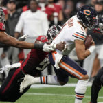 
              Chicago Bears quarterback Justin Fields (1) runs against the Chicago Bears during the first half of an NFL football game, Sunday, Nov. 20, 2022, in Atlanta. (AP Photo/Brynn Anderson)
            