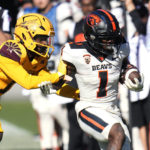 Oregon State wide receiver Tyjon Lindsey (1) is forced out of bounds by Arizona State defensive back Jordan Clark (1) during the second half of an NCAA college football game in Tempe, Ariz., Saturday, Nov. 19, 2022. Oregon State won 31-7. (AP Photo/Ross D. Franklin)