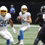 
              CORRECTS DATE TO SUNDAY, NOV. 6 INSTEAD OF TUESDAY, DEC. 6 - Los Angeles Chargers quarterback Justin Herbert (10) looks to pass during the first half of an NFL football game Atlanta Falcons, Sunday, Nov. 6, 2022, in Atlanta. (AP Photo/Butch Dill)
            