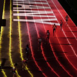 
              FILE - Competitors are introduced to the crowd before the women's 4x100 meter relay final at the World Athletics Championships in Doha, Qatar, Saturday, Oct. 5, 2019. The World Cup is just one way Qatar is using its massive wealth to project influence. By buying sports teams, hosting high-profile events, and investing billions in European capitals — such as buying London’s The Shard skyscraper — Qatar has been integrating itself into international finance and a network of support.    
 (AP Photo/Nariman El-Mofty, File)
            