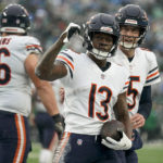 Chicago Bears wide receiver Byron Pringle (13) celebrates with quarterback Trevor Siemian (15) after scoring a touchdown against the New York Jets during the first quarter of an NFL football game, Sunday, Nov. 27, 2022, in East Rutherford, N.J. (AP Photo/Seth Wenig)