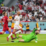 From left, Denmark's Joachim Andersen, Tunisia's Issam Jebali, and Denmark's goalkeeper Kasper Schmeichel in action during the World Cup group D soccer match between Denmark and Tunisia, at the Education City Stadium in Al Rayyan , Qatar, Tuesday, Nov. 22, 2022. (AP Photo/Petr David Josek)