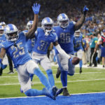 Detroit Lions safety Kerby Joseph (31) and teammates react after an interception by Joseph during the second half of an NFL football game against the Green Bay Packers, Sunday, Nov. 6, 2022, in Detroit. (AP Photo/Paul Sancya)