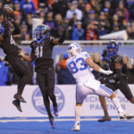 
              Boise State safety Rodney Robinson (4) catches the ball for an interception on a throw to BYU tight end Isaac Rex (83) in front of Boise State cornerback Jaylen Clark (41) in the first half of an NCAA college football game, Saturday, Nov. 5, 2022, in Boise, Idaho. (AP Photo/Steve Conner)
            