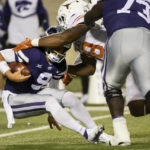 
              Kansas State quarterback Adrian Martinez (9) is sacked by Texas defensive end Barryn Sorrell (88) during the first half of an NCAA college football game Saturday, Nov. 5, 2022, in Manhattan, Kan. (AP Photo/Reed Hoffmann)
            