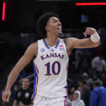 Kansas forward Jalen Wilson (10) reacts to a scar against Duke during the second half of an NCAA college basketball game, Wednesday, Nov. 16, 2022, in Indianapolis. (AP Photo/Darron Cummings)
