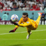
              Tunisia's goalkeeper Aymen Dahmen reaches for the ball during the World Cup group D soccer match between Denmark and Tunisia, at the Education City Stadium in Al Rayyan , Qatar, Tuesday, Nov. 22, 2022. (AP Photo/Petr David Josek)
            