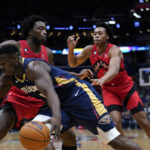 New Orleans Pelicans forward Zion Williamson (1) drives to the basket in the first half of an NBA basketball game against the Toronto Raptors in New Orleans, Wednesday, Nov. 30, 2022. (AP Photo/Gerald Herbert)