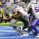 
              Detroit Lions quarterback Jared Goff (16) is tackled by Buffalo Bills defensive tackle Ed Oliver (91) for a safety during the second half of an NFL football game, Thursday, Nov. 24, 2022, in Detroit. (AP Photo/Paul Sancya)
            