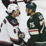 
              Arizona Coyotes defenseman Jakob Chychrun (6) and Minnesota Wild right wing Ryan Reaves (75) exchange words during the second period of an NHL hockey game, Sunday, Nov. 27, 2022, in St. Paul, Minn. (AP Photo/Stacy Bengs)
            