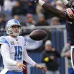 Chicago Bears linebacker Joe Thomas (45) bats down a Detroit Lions quarterback Jared Goff (16) pass during the first half of an NFL football game in Chicago, Sunday, Nov. 13, 2022. (AP Photo/Charles Rex Arbogast)