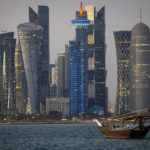
              FILE - A traditional dhow boat sails towards the West Bay in Doha, Qatar, Thursday, Nov. 25, 2021. Qatar has sought to portray itself as welcoming foreigners to this hereditarily ruled emirate, where traditional Muslim values remain strong.(AP Photo/Darko Bandic, File)
            