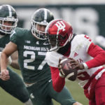 
              Indiana quarterback Dexter Williams II (5) is chased by Michigan State linebacker Cal Haladay (27) during the second half of an NCAA college football game, Saturday, Nov. 19, 2022, in East Lansing, Mich. (AP Photo/Carlos Osorio)
            