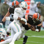 Miami Dolphins Bradley Chubb (2) and defensive tackle Christian Wilkins (94) sack Cleveland Browns quarterback Jacoby Brissett (7)during the first half of an NFL football game, Sunday, Nov. 13, 2022, in Miami Gardens, Fla. (AP Photo/Lynne Sladky)