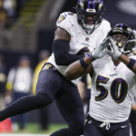 Baltimore Ravens linebackers Patrick Queen, left, and Justin Houston celebrate after a sack in the second half of an NFL football game against the New Orleans Saints in New Orleans, Monday, Nov. 7, 2022. (AP Photo/Butch Dill)