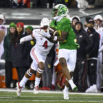 Oregon wide receiver Dont'e Thornton (2) hauls in a pass against Utah cornerback JaTravis Broughton (4) during the first half of an NCAA college football game Saturday, Nov. 19, 2022, in Eugene, Ore. (AP Photo/Andy Nelson)