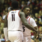Arizona center Oumar Ballo (11) reacts with guard Cedric Henderson Jr., after he scored against San Diego State during the second half of an NCAA college basketball game, Tuesday, Nov. 22, 2022, in Lahaina, Hawaii. (AP Photo/Marco Garcia)