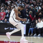 
              Brooklyn Nets forward Kevin Durant reacts after scoring against the Portland Trail Blazers during the second half of an NBA basketball game in Portland, Ore., Thursday, Nov. 17, 2022. (AP Photo/Craig Mitchelldyer)
            