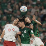 
              Mexico's Cesar Montes, right, and Edson Alvarez, center, fight for the ball with Poland's Jakub Kiwior during the World Cup group C soccer match between Mexico and Poland, at the Stadium 974 in Doha, Qatar, Tuesday, Nov. 22, 2022. (AP Photo/Moises Castillo)
            