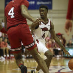 
              Arkansas guard Davonte Davis (4) looks for an open teammate during the first half of an NCAA college basketball game against Louisville, Monday, Nov. 21, 2022, in Lahaina, Hawaii. (AP Photo/Marco Garcia)
            