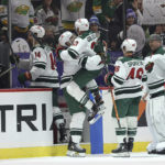 
              Minnesota Wild defenseman Alex Goligoski (33) jumps into the arms of left wing Marcus Foligno (17) in celebration after Goligoski scored in overtime against the Carolina Hurricanes during an NHL hockey game Saturday, Nov. 19, 2022, in St. Paul, Minn. (AP Photo/Stacy Bengs)
            