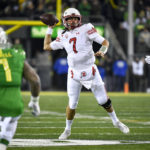 
              Utah quarterback Cameron Rising (7) passes the ball again Oregon during the first half of an NCAA college football game Saturday, Nov. 19, 2022, in Eugene, Ore. (AP Photo/Andy Nelson)
            