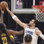 
              Indiana Pacers forward Isaiah Jackson, left, has his shot blocked by Los Angeles Clippers center Ivica Zubac during the first half of an NBA basketball game Sunday, Nov. 27, 2022, in Los Angeles. (AP Photo/Mark J. Terrill)
            