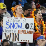 
              A football fan holds a sign during the first half of an NFL football game between the Buffalo Bills and the Cleveland Browns, Sunday, Nov. 20, 2022, in Detroit. (AP Photo/Paul Sancya)
            