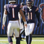 
              Chicago Bears wide receiver Darnell Mooney (11) is congratulated by quarterback Justin Fields (1) after Mooney scored a touch down during the first half of an NFL football game against the Miami Dolphins, Sunday, Nov. 6, 2022 in Chicago. (AP Photo/Charles Rex Arbogast)
            