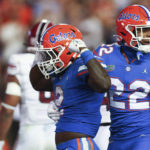 
              Florida running back Montrell Johnson Jr. (2) celebrates with wide receiver Kahleil Jackson (22) after scoring a touchdown against South Carolina during the second half of an NCAA college football game, Saturday, Nov. 12, 2022, in Gainesville, Fla. (AP Photo/Matt Stamey)
            