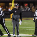 
              New Mexico State head coach Jerry Kill, center, argues a call with officials during the second quarter of the team's NCAA college football game against Missouri on Saturday, Nov. 19, 2022, in Columbia, Mo. (AP Photo/L.G. Patterson)
            