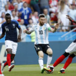 
              FILE - Argentina's Lionel Messi, center, is stopped by France's Paul Pogba, right, and France's Blaise Matuidi during the round of 16 match between France and Argentina, at the 2018 soccer World Cup at the Kazan Arena in Kazan, Russia, Saturday, June 30, 2018. (AP Photo/David Vincent, File)
            
