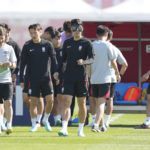 South Korea's Son Heung-min, center, arrives with his teammates for the South Korea's official training on the eve of the group H World Cup soccer match between Uruguay and South Korea at the Al Egla Training Site 5 in Doha, Qatar, Wednesday, Nov. 23, 2022. (AP Photo/Lee Jin-man)