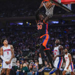 
              New York Knicks' Julius Randle (30) dunks in front of Detroit Pistons' Isaiah Stewart (28) during the second half of an NBA basketball game Friday, Nov. 11, 2022, in New York. The Knicks won 121-112. (AP Photo/Frank Franklin II)
            