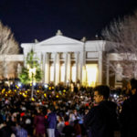 
              Students and community members gather for a candlelight vigil after a shooting that left three students dead the night before at the University of Virginia, Monday, Nov. 14, 2022, in Charlottesville, Va. (Shaban Athuman/Richmond Times-Dispatch via AP)
            