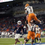 
              UTEP quarterback Calvin Brownholtz (7) is lifted by teammate Elijah Klein (79) after running for a touchdown against UTSA during the first half of an NCAA college football game in San Antonio, Saturday, Nov. 26, 2022. (AP Photo/Eric Gay)
            